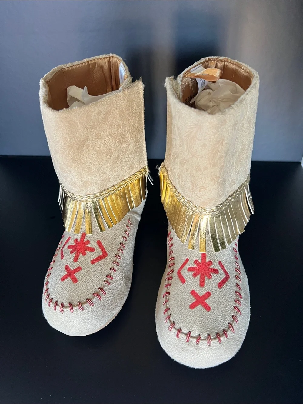 Disney Beige Moccasin Boots with Gold Fringe and Red Embroidery